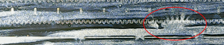 Bild: Durchgebrannte Düsen bei 1000facher Vergrößerung.